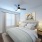 Secondary bedroom with soft natural light, neutral décor, and flexible space suitable for guests, a home office, or additional living needs