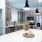 Contemporary open kitchen featuring a spacious island, sleek cabinetry, and integrated appliances, perfect for cooking and entertaining