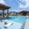 Oak at Katy Park pool with in-water lounge chairs and shaded seating