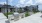 Outdoor corn hole area, pool, and grills