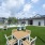 Outdoor seating near grills under twinkle lights